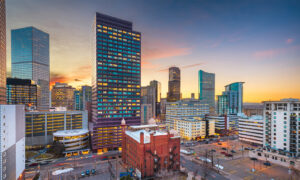 Denver, Colorado, USA downtown cityscape rooftop view at dusk.